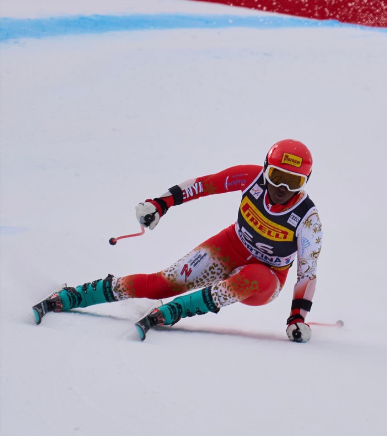 Sabrina Simader carving a turn in her leopard-print race suit